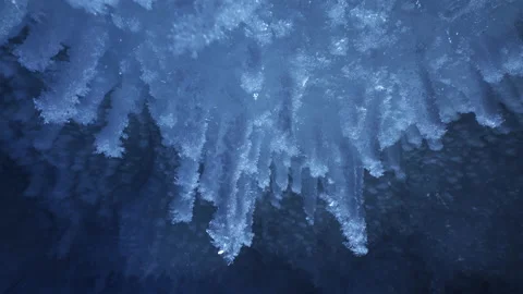 Beautiful crystal icicles, blue sharp ice floes inside frozen cave Stock Footage 180325966