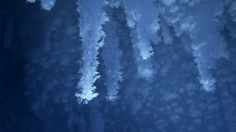 Beautiful crystal icicles, blue sharp ice snowflakes inside frozen cave Stock Footage 182374028