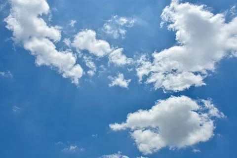 Beautiful cumulus clouds against the blue daytime sky. Stock Photos