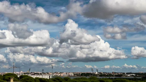 Beautiful Cumulus Clouds over Town Stock Footage 41574380