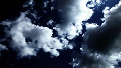 Beautiful cumulus clouds overhead in deep blue sky Stock Footage 36968634