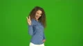 The beautiful curly woman gesture and stand on the green background. Real time 4k or 4k+ Resolution