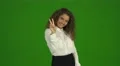 The beautiful curly woman gesture and stand on the green background. Real time 4k or 4k+ Resolution