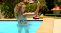 Beautiful Curly Woman Making Selfie in the Swimming Pool. HD Footage