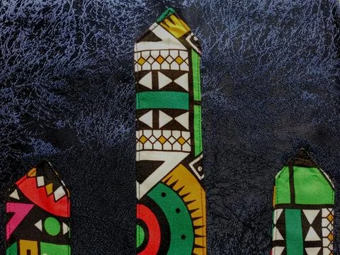 Beautiful cut design pattern of African print cloth on plain fabric 库存照片