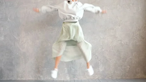 Beautiful cute smiling model jumping Stock Footage 140897862