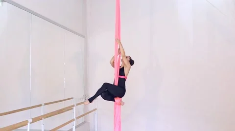 Beautiful dancer on aerial silk in studio Stock Footage 65515876