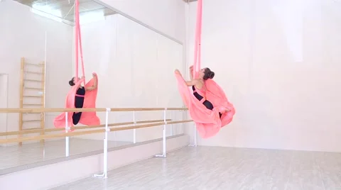 Beautiful dancer on aerial silk in studio Stock Footage 65515919