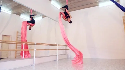 Beautiful dancer on aerial silk in studio Stock Footage 65516041