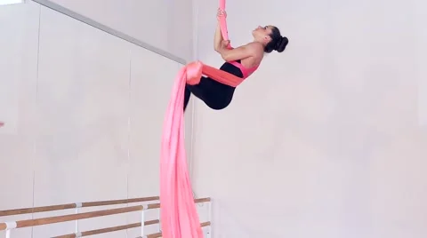 Beautiful dancer on aerial silk in studio Stock Footage 65516148