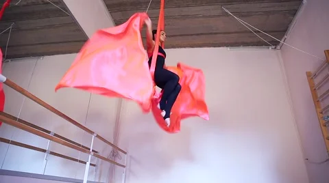 Beautiful dancer on aerial silk in studio Stock Footage 65516347