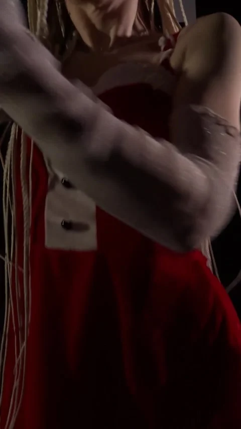A beautiful dancer with dreadlocks in a New Year's costume 스톡 동영상 332598878