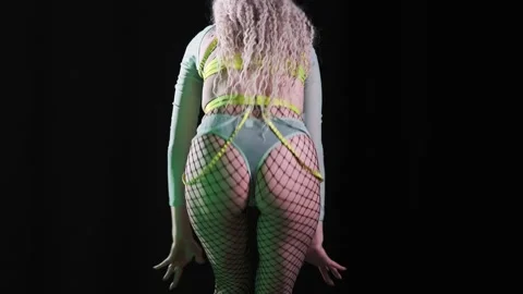 Beautiful dancer with dreadlocks in a sexy costume dances beautifully and moves  Stock Footage 235961975