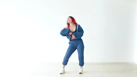 A beautiful dancer modern dances on a white background. Stock Footage 150902971