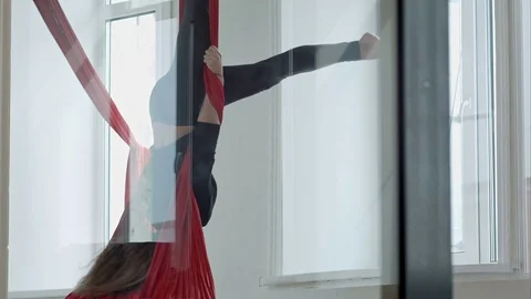 Beautiful dancer posing on aerial fabric in class Video stock 76408886