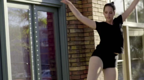 Beautiful Dancer Practices Choreography Outside Of Stores Downtown (Slow Motion) Stock Footage 53418155