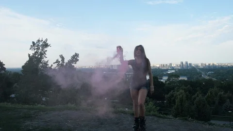 Beautiful dances on the observation deck of the city. Attractive girl jumps in Stock Footage 112255772