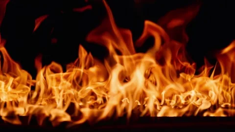 Beautiful dancing fire, the surface is ablaze. Lots of fire. Close-up immersion Stock Footage 283495568