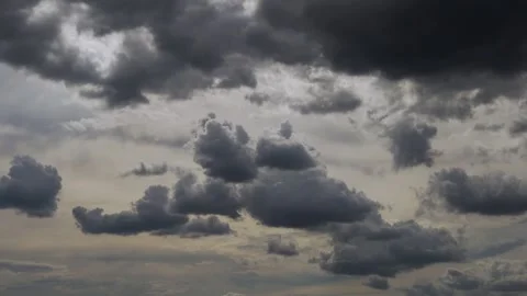 Beautiful Dark Black Storm Clouds Gather in a Gray Sky in Sunlight, Slow Motion  Stockbeeldmateriaal 332216832