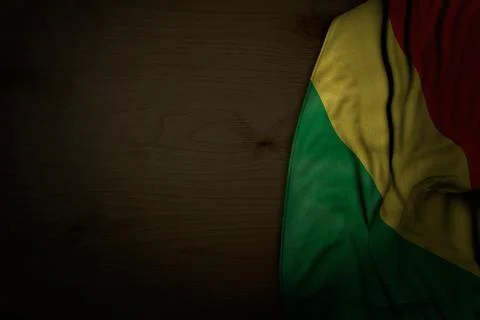 Beautiful dark image of Congo flag with big folds on dark wood with free space Stock Illustration