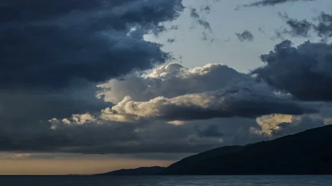 Beautiful Dark Storm rain  Clouds over the Sea Stock-Footage 83795589