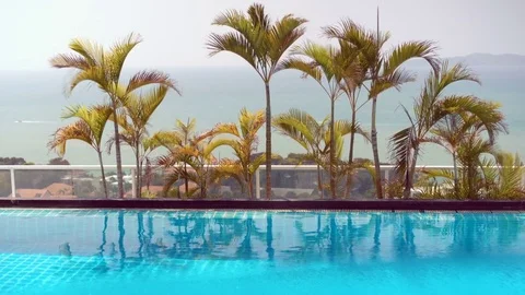 Beautiful day on the tropical beach. Turquoise sea with rocky island in the Stock Footage