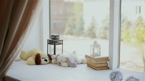 Beautiful decor in the studio, violin and books on the window Stock Footage 49743177