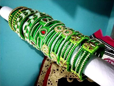 Beautiful decorated green bangles made up of threads Stock Photos