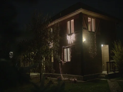 Beautiful decorated wooden house decorated with Christmas lights Stock Footage