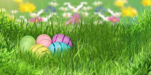 Beautiful decorative easter eggs lie in green grass Stock Photos