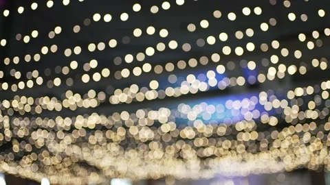 Beautiful decorative lighting defocused. Lots of small glowing round lamps Stock Footage 153147696