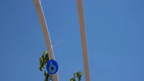 Beautiful decore with evil eye beads swing in the wind Stock Footage 133772187