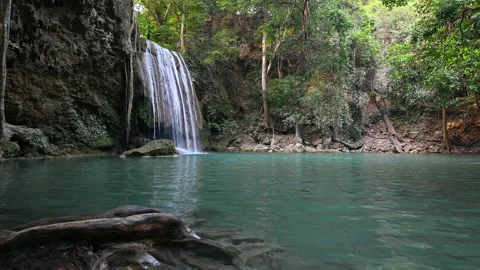 Beautiful deep forest tropical climate waterfall emerald pool Stock Footage 133851464