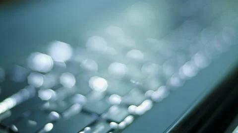 Beautiful defocused light of a dark keyboard at night, macro shot Stock Footage 64217145