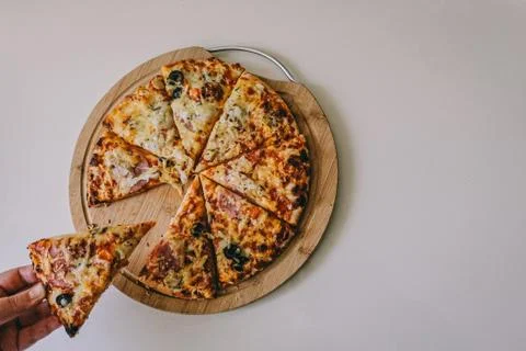 Beautiful delicious pizza on a wooden Board Stock Photos