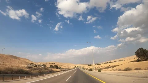 Beautiful desert view. Car driving on the road to Eilat, Israel. Inside view of Stock Footage 148997331