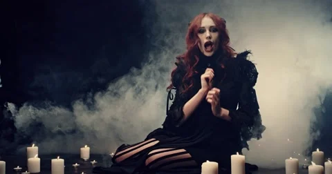 Beautiful devil and Halloween accessories on black Stock Footage 56274479