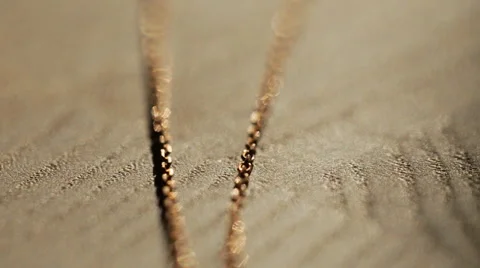 A beautiful diamond of wedding ring dangles from a chain. Fine Jewelry isolated Video stock 65957688