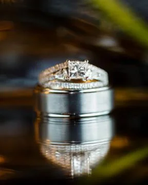 Beautiful Diamond Wedding Ring with reflection and abstract background. Stock Photos