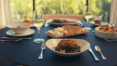 Beautiful Dinner Setup at a Restaurant with beets chicken bread wine cinematic Stock Footage 280514654