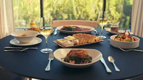 Beautiful Dinner Setup at a Restaurant with beets chicken bread wine cinematic Vídeos de archivo 280514657