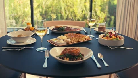 Beautiful Dinner Setup at a Restaurant with beets chicken bread wine cinematic Vidéo 280514663