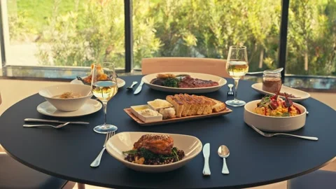 Beautiful Dinner Setup at a Restaurant with beets chicken bread wine cinematic Stockbeeldmateriaal 280514668