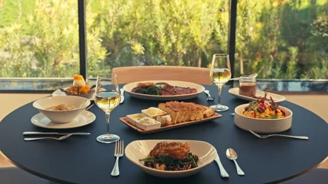Beautiful Dinner Setup at a Restaurant with beets chicken bread wine cinematic Vidéo 280514672