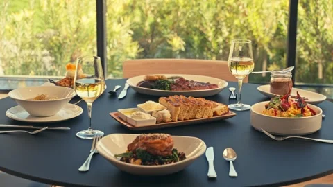 Beautiful Dinner Setup at a Restaurant with beets chicken bread wine cinematic Stockbeeldmateriaal 280514676