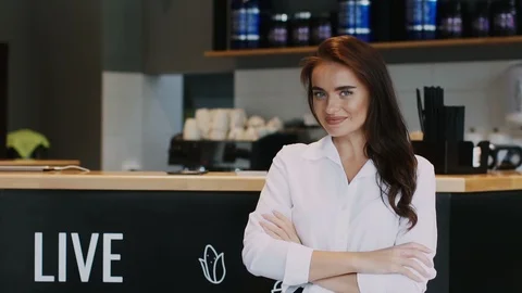 Beautiful director of restaurant showing something and smiling Stock Footage 113864341