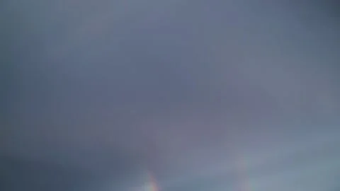 Beautiful double rainbow in the rainy sky. Rayny evening in a small coastal Video stock 132408677