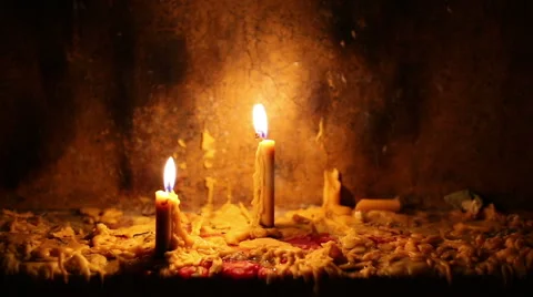 Beautiful dramatic candle lights and melting wax Stock Footage 58450602