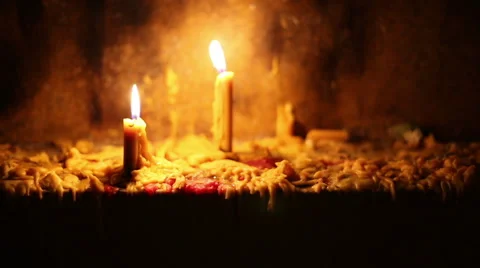 Beautiful dramatic candle lights and melting wax Stock Footage 58451184