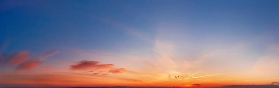 Beautiful dramatic cloudscape at sunset with clouds. Stock Photos